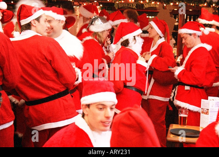 Gathering of Santas at Victoria Station in London December 2004 Stock Photo