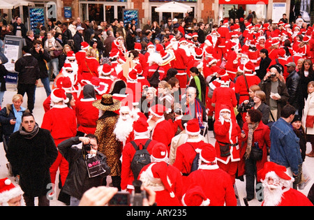 Gathering of Santas at Victoria Station in London December 2004 Stock Photo