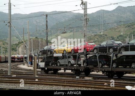new cars being transported by train seat railway rail car seat in switching yard shunting yard on he french spainish boarder at Stock Photo