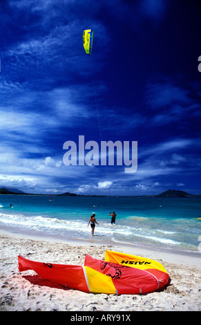 Kitesurfers flock to the waters off Kailua Beach on Oahu to take advantage of strong trade winds. Stock Photo