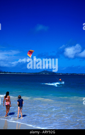 Kitesurfers flock to the waters off Kailua Beach on Oahu to take advantage of strong trade winds. Stock Photo