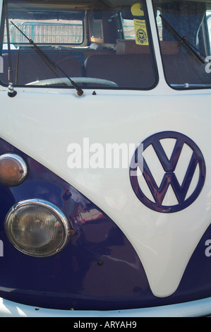 A blue Volkswagen VW type 2 bay camper van with Comic eyes on the ...