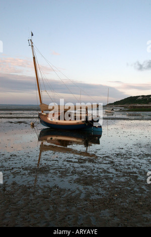 Sailboat at low tide on the tidal flats, Brewster, Massachusetts. Stock Photo