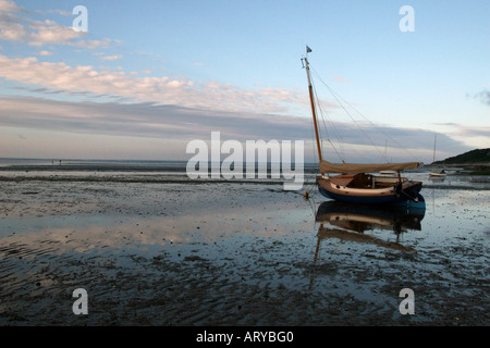 Sailboat at low tide on the tidal flats, Brewster, Massachusetts. Stock Photo