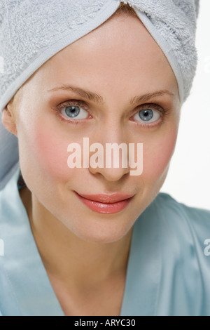 Smiling woman with towel on head Stock Photo