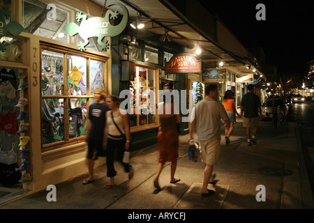 Shoppers head out into evening to enjoy stores, art galleries & restaurants along Front street historic downtown Lahiana, Maui Stock Photo