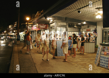 Shoppers head out into evening to enjoy stores, art galleries & restaurants along Front street historic downtown Lahiana, Maui Stock Photo