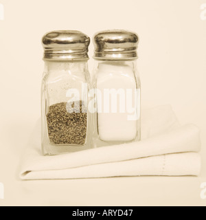 Salt and pepper shakers with napkin Stock Photo