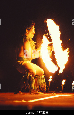 Man performing a Polynesian fire dance, the entertainment at a luau, Sheraton Royal Hawaiian Hotel, Waikiki, Oahu Stock Photo