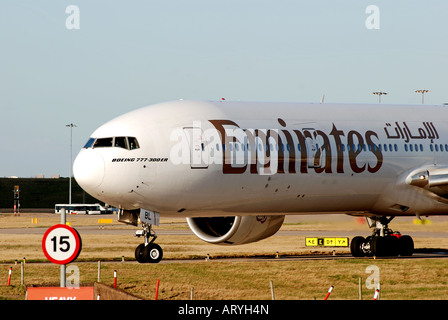 Emirates Airlines Boeing 777 aircraft taxiing at Birmingham International Airport, England, UK Stock Photo