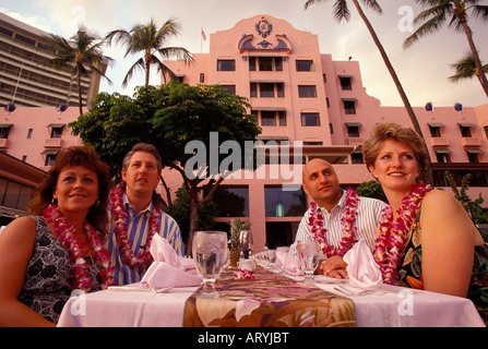 Tourists enjoying the luau at the Royal Hawaiian Hotel in Waikiki Stock Photo