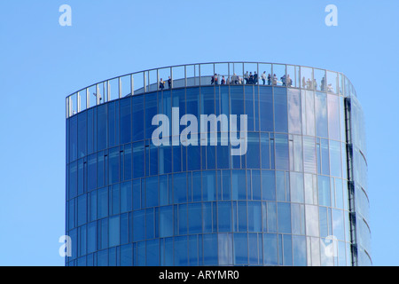 Cologne Triangel building with people silhouettes on top roof terrace Köln Deutz North Rhine Westphalia Germany Stock Photo