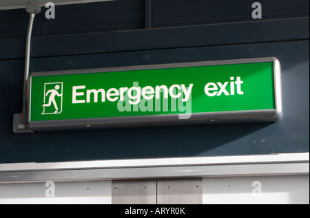 Emergency exit sign in Gatwick airport Stock Photo