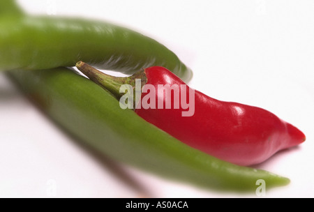 one red and two green chilli peppers Stock Photo