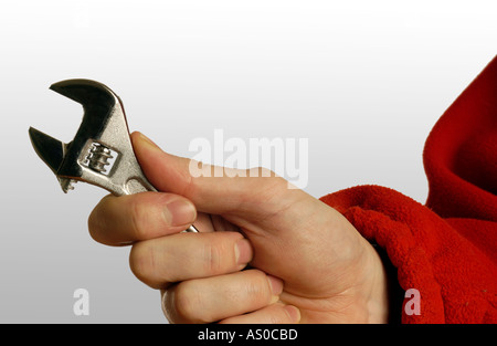 man holding adjustable spanner in his hand Stock Photo