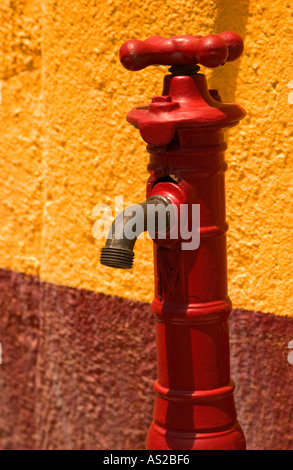 Old red water faucet. USA Stock Photo