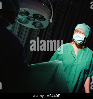 Nurse monitoring operation Stock Photo