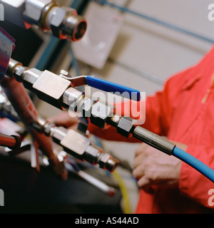 Engineer working on machine Stock Photo