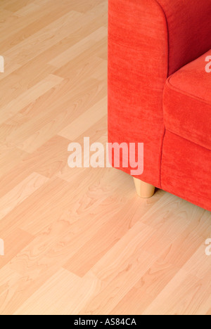 red sofa on a wooden floor Stock Photo