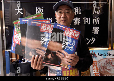 A man sells the Japanese edition of The Big Issue in Osaka Japan Stock Photo