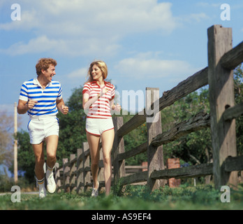 couple jogging on running track Stock Photo