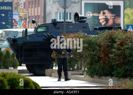 Bosnian Serb Special Forces Soldier and BRDM Armoured Vehicle During a Raid Against Organised Crime Stock Photo