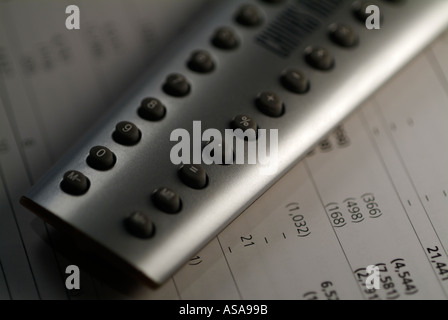 Calculator on a Page of Figures Stock Photo