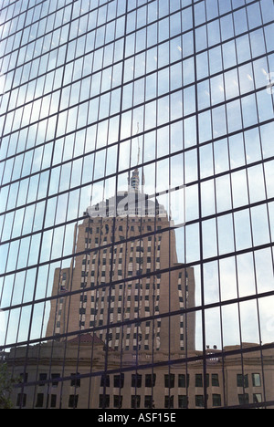 A reflection of the John Hancock Building in the glass windows of the Hancock Tower in Boston Massachusetts Stock Photo