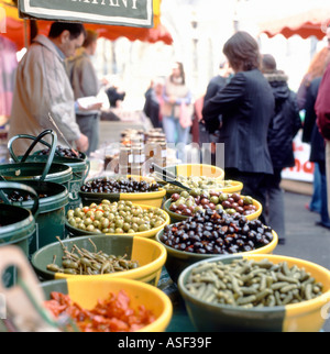 Trader selling olives on a food stall at Borough Market,  London Bridge   Southwark South London UK  KATHY DEWITT Stock Photo