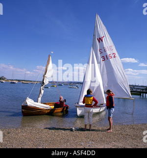 Sailing two Generations young and old people at Keyhaven Hampshire England UK Stock Photo