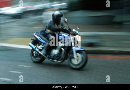Motor bike messenger in central London Stock Photo