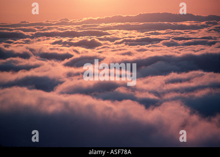 Sunset over clouds Stock Photo