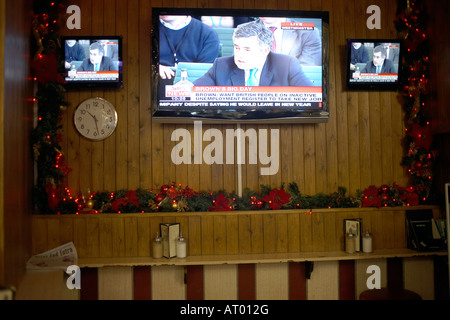 Prime Minister Gordon Brown answers questions at Westminster broadcast live on Sky News wide screen TV in Bar Italia cafe Soho Stock Photo