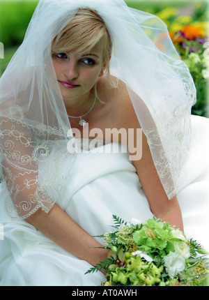 Portrait of beautiful bride in wedding dress and veil. Stock Photo