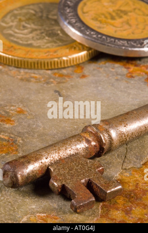 Old skeleton type keys on a solid slate stone foundation Stock Photo