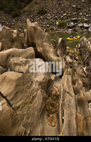 Interesting rock formations with raft beyond along the Colorado River ...