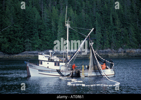 commercial sien net fishing for salmon crew pulls in net Southeast Alaska Stock Photo