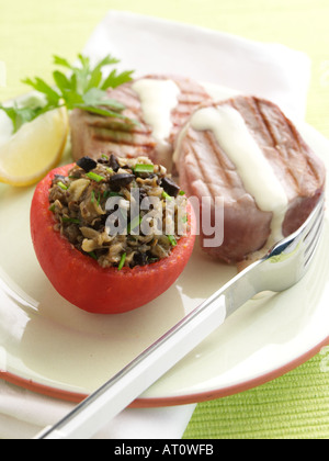 Stuffed tomato griddled tuna Stock Photo