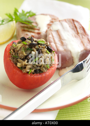 Stuffed tomato griddled tuna Stock Photo