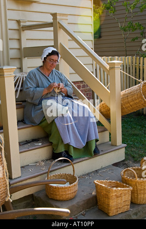 Basket maker outside Colonial Williamsburg shop in colonial dress Stock Photo