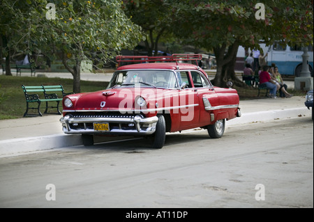 A classic American car seen in Havana center. Thousands of vintage American  cars remain scattered throughout Cuba, manufactured before the revolution  and subsequent US embargo in 1960. With no automobile imports coming