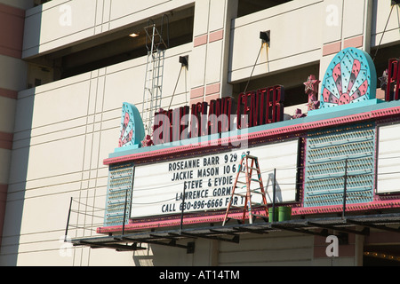 ILLINOIS Aurora Step ladder and buckets near marquee sign schedule of artists and concerts hanging on building Stock Photo