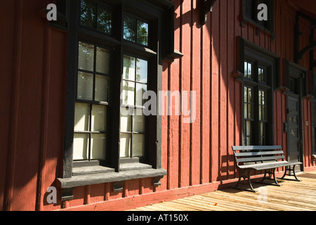 ILLINOIS Batavia Bench along wall of depot location of museum with railroad and war relics Stock Photo