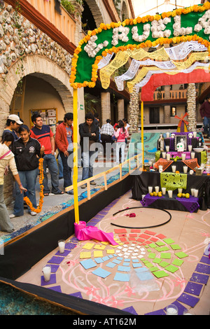 MEXICO Guanajuato High school students prepare Day of the Dead shrine like a boat colorful paper candles and skulls Stock Photo