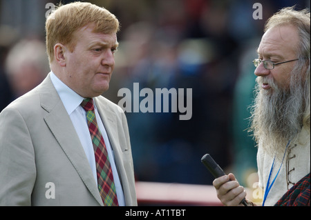 Charles Kennedy being interviewed at a shinty match Stock Photo