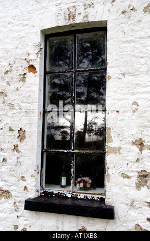 Old communion wine bottle in window of closed Welsh Bethesda Chapel at Brechfa near Brecon Powys Wales UK dated 1802 Stock Photo