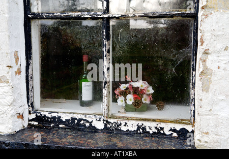 Old communion wine bottle in window of closed Welsh Bethesda Chapel at Brechfa near Brecon Powys Wales UK dated 1802 Stock Photo