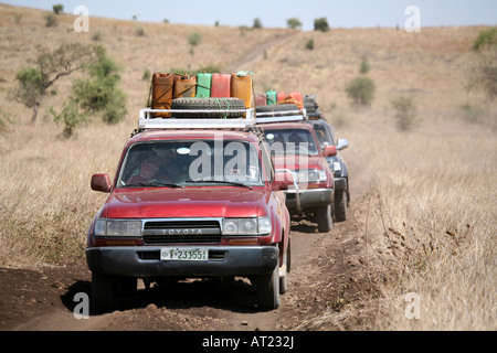Convoy of four wheel drive vehicles on African safari Stock Photo