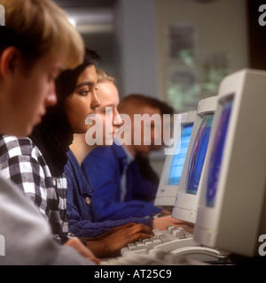 1990’s School computer class teenage senior students 15-17 years working at their classroom school computer screens. Retro vintage  computer class. Stock Photo