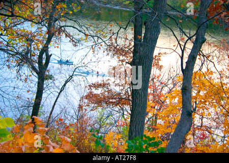 Autumn view of Mississippi River with racing sculls skimming along the surface. St Paul Minnesota MN USA Stock Photo